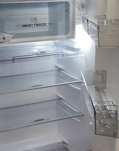 Fridge available in the kitchen of the apartment with view over Auroville green belt