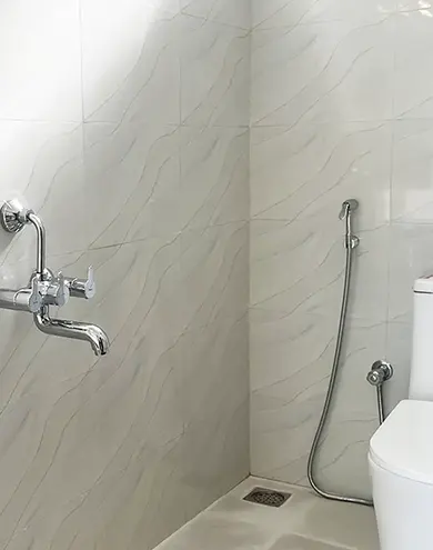 Clean and modern bathroom with toilet and shower at Surya Villa