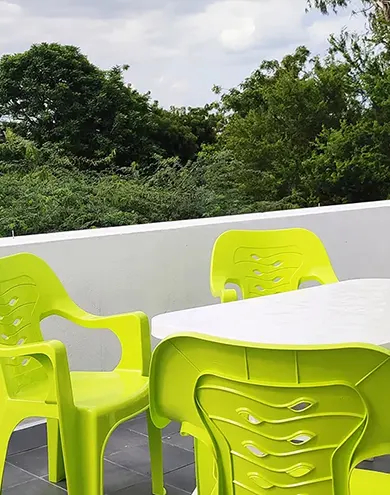 Private terrace with scenic view over Auroville's Green Belt, ideal for relaxing in nature